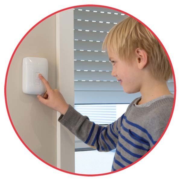 young boy pushing button