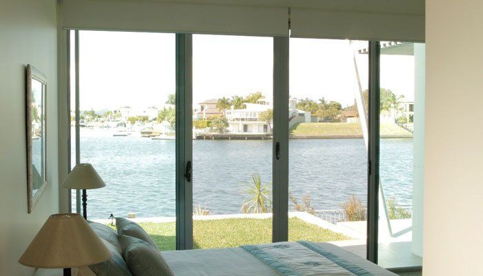 bedroom with large glass sliding door