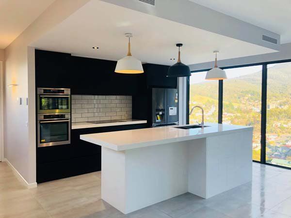 white island black walls kitchen