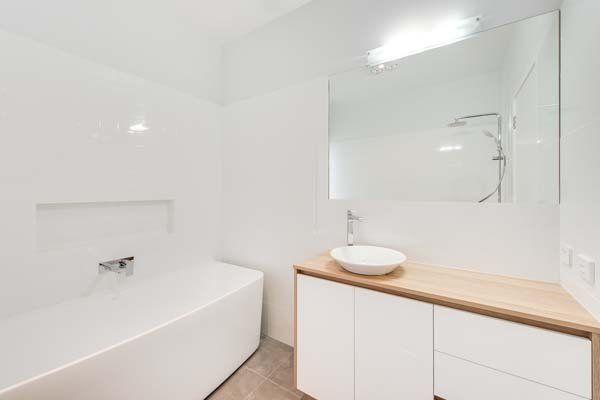 sleek white and wood washroom
