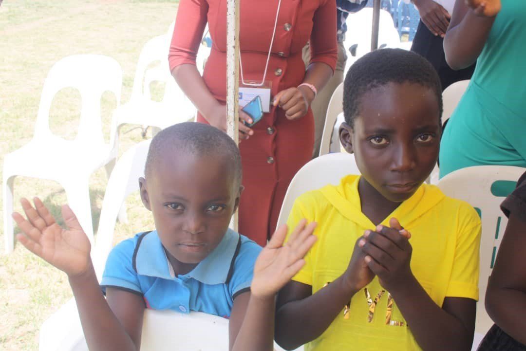 children praying at a service