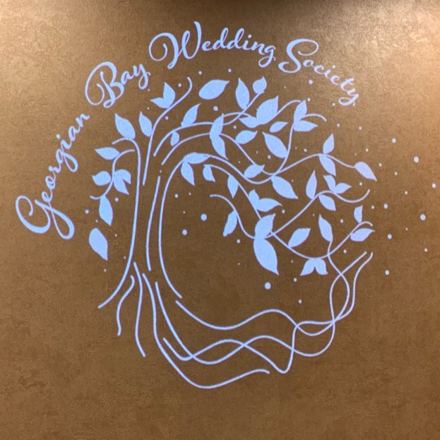 White logo on a gold background, featuring a stylized tree and the words