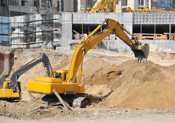 Yellow Tractor — New Construction Site Yellow Crane Digging Sands in Florida, USA