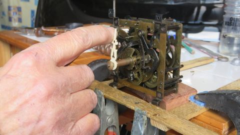 A Man Fixing A Clock — Buford, GA — The Clock Shop Inc. A Man Fixing A Clock — Buford, GA — The Clock Shop Inc.