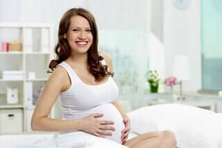 Pregnant Woman Smiling — Gynecology in Mchenry, IL Pregnant Woman Smiling — Gynecology in Mchenry, IL