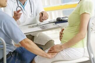 Doctor Giving A Medication — Gynecology in Mchenry, IL Doctor Giving A Medication — Gynecology in Mchenry, IL