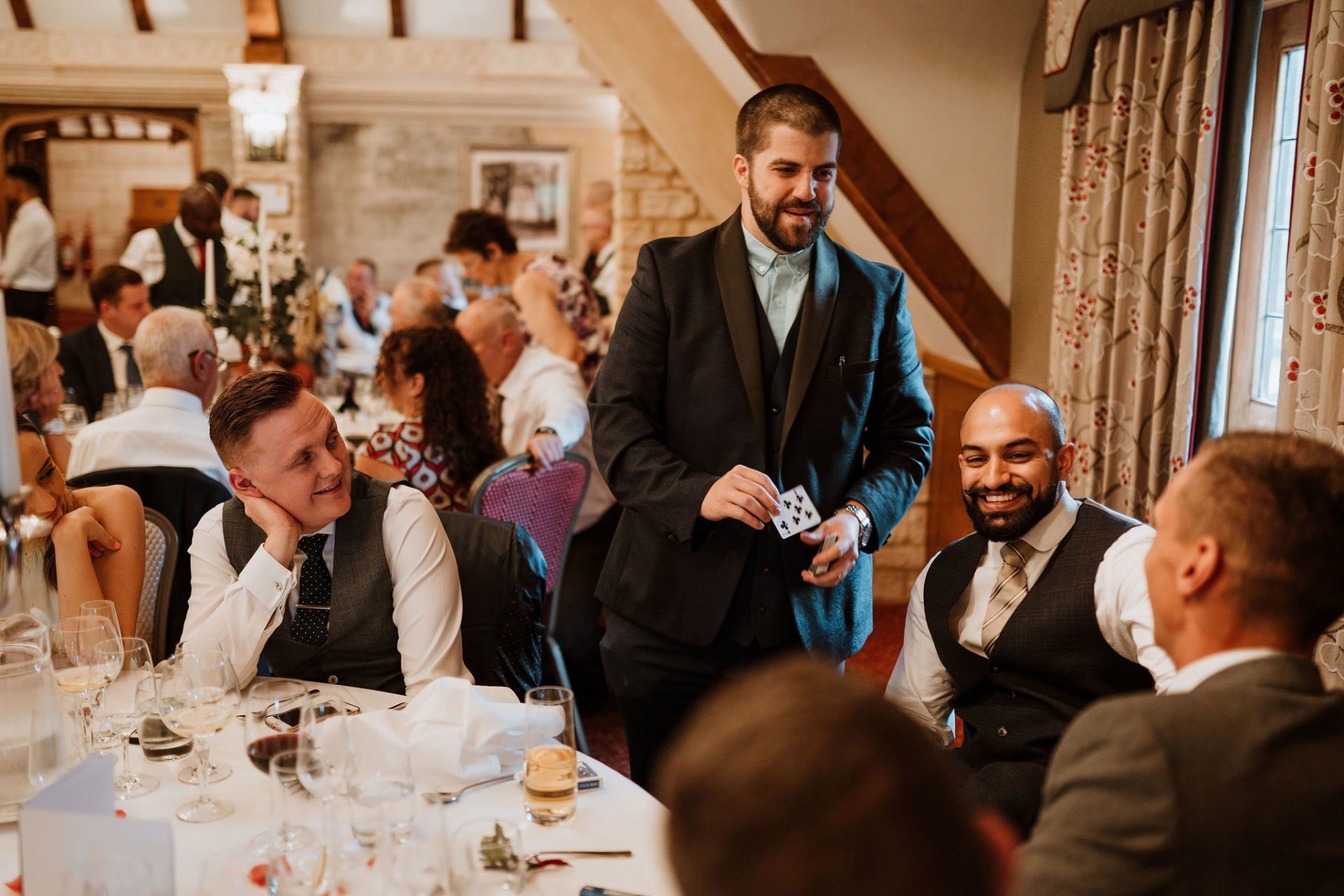 Table magic by London wedding magician Daniel Chard during the wedding breakfast