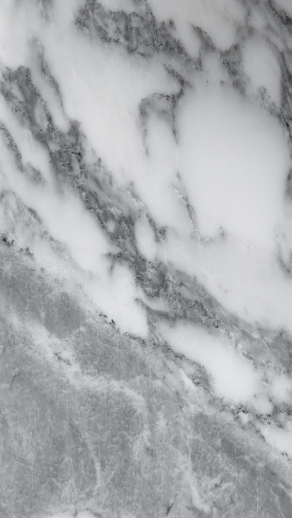 White marble surface with gray veining.