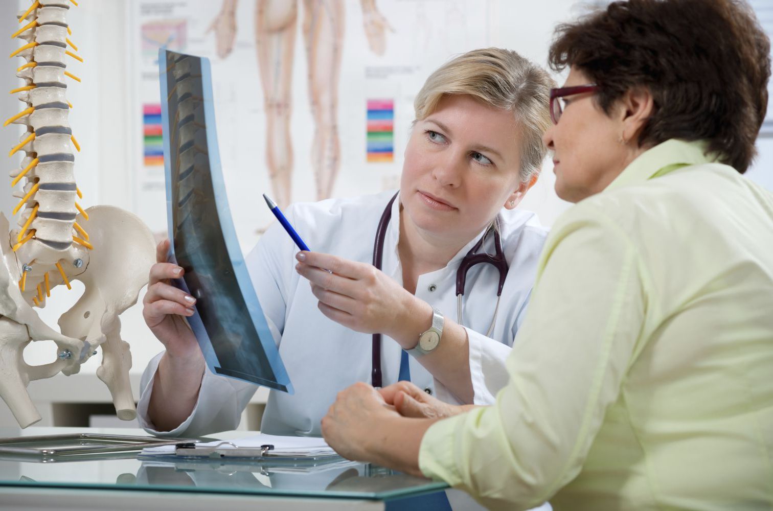 Woman consulting a chiropractor in Foley, AL