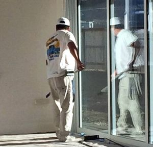 Painting And Staining — Man Painting A Wall in Sparks, NV