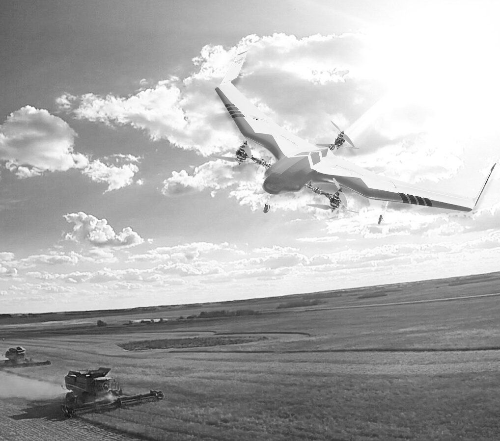 A drone flies above agricultural machinery harvesting a crop in a wide, sunny field under a cloudy sky.