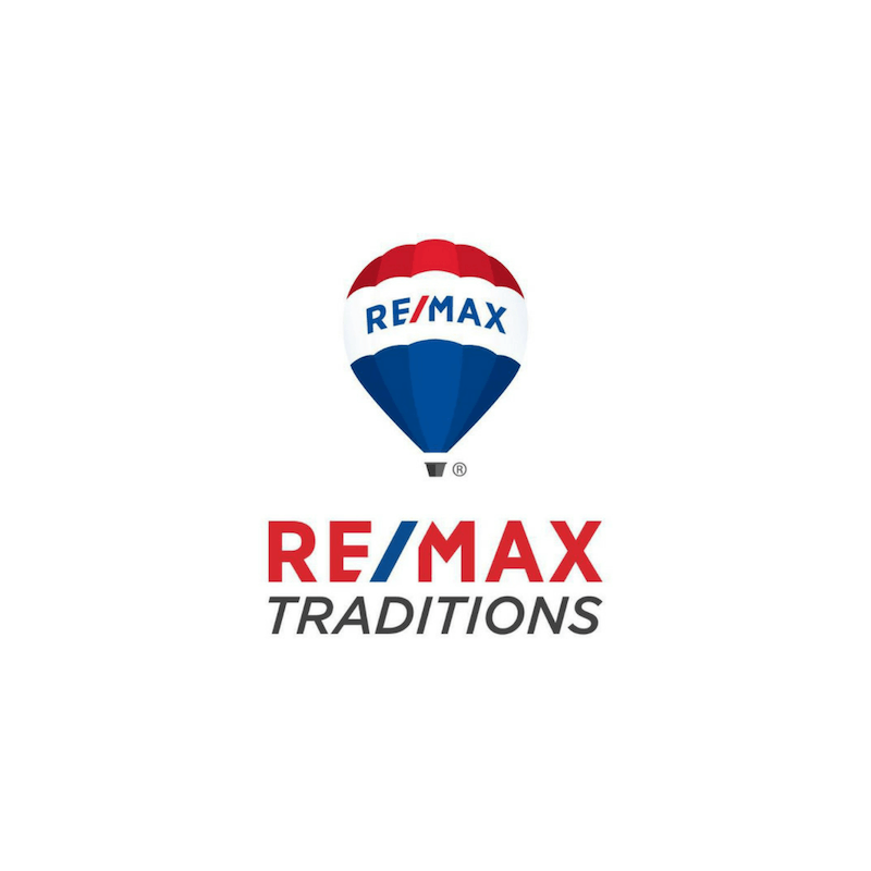 RE/MAX Traditions logo: Red, white, and blue hot air balloon with company name below.