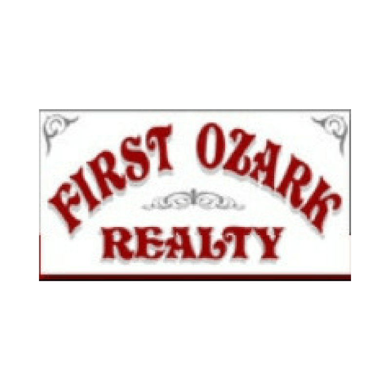 Logo for First Ozark Realty, red text on white background with decorative border.
