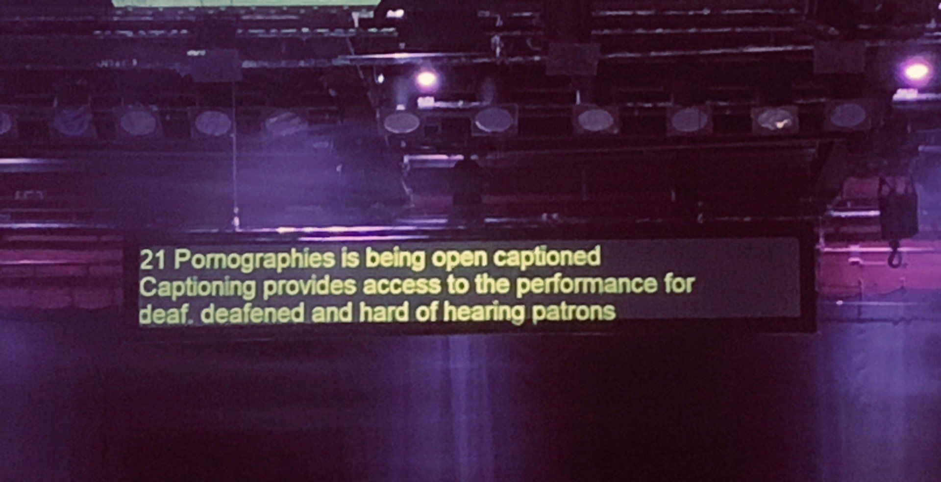 Hanging caption unit at theatre displaying text. Hanging caption unit at theatre displaying text.