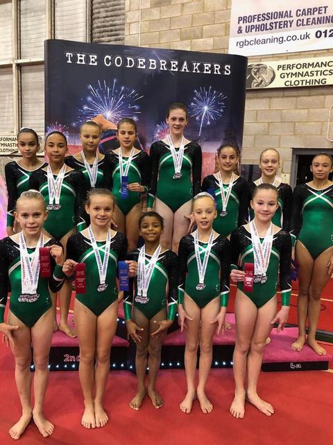 group of gymnasts with medals