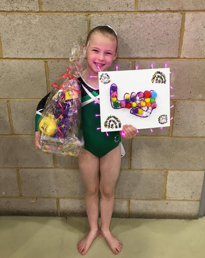 gymnast with prizes