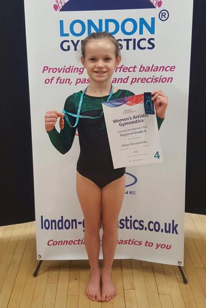 a regional grade 4 gymnast winning bronze all around