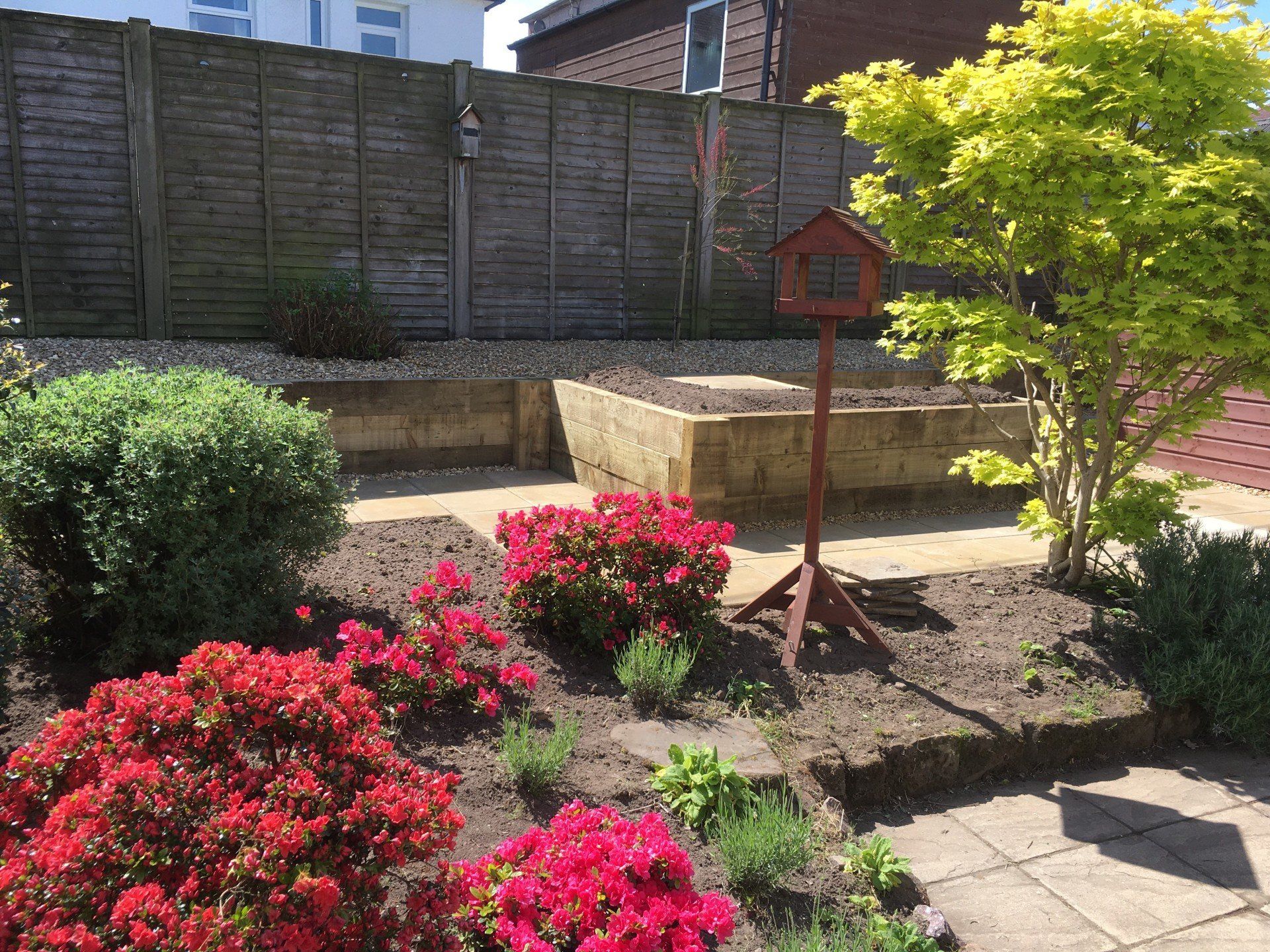 Flower beds and raised area in garden design