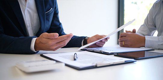 Insurance Officer Explaining with Client — Crescent City, CA — Crescent Land Title Company Insurance Officer Explaining with Client — Crescent City, CA — Crescent Land Title Company