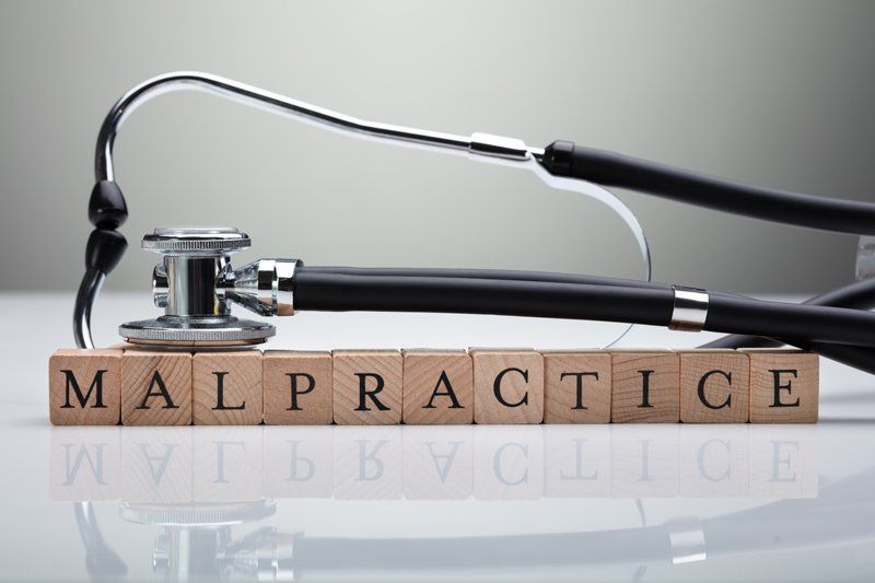 Automobile Attorney — Stethoscope Over Malpractice Wooden Block in Salem, OR