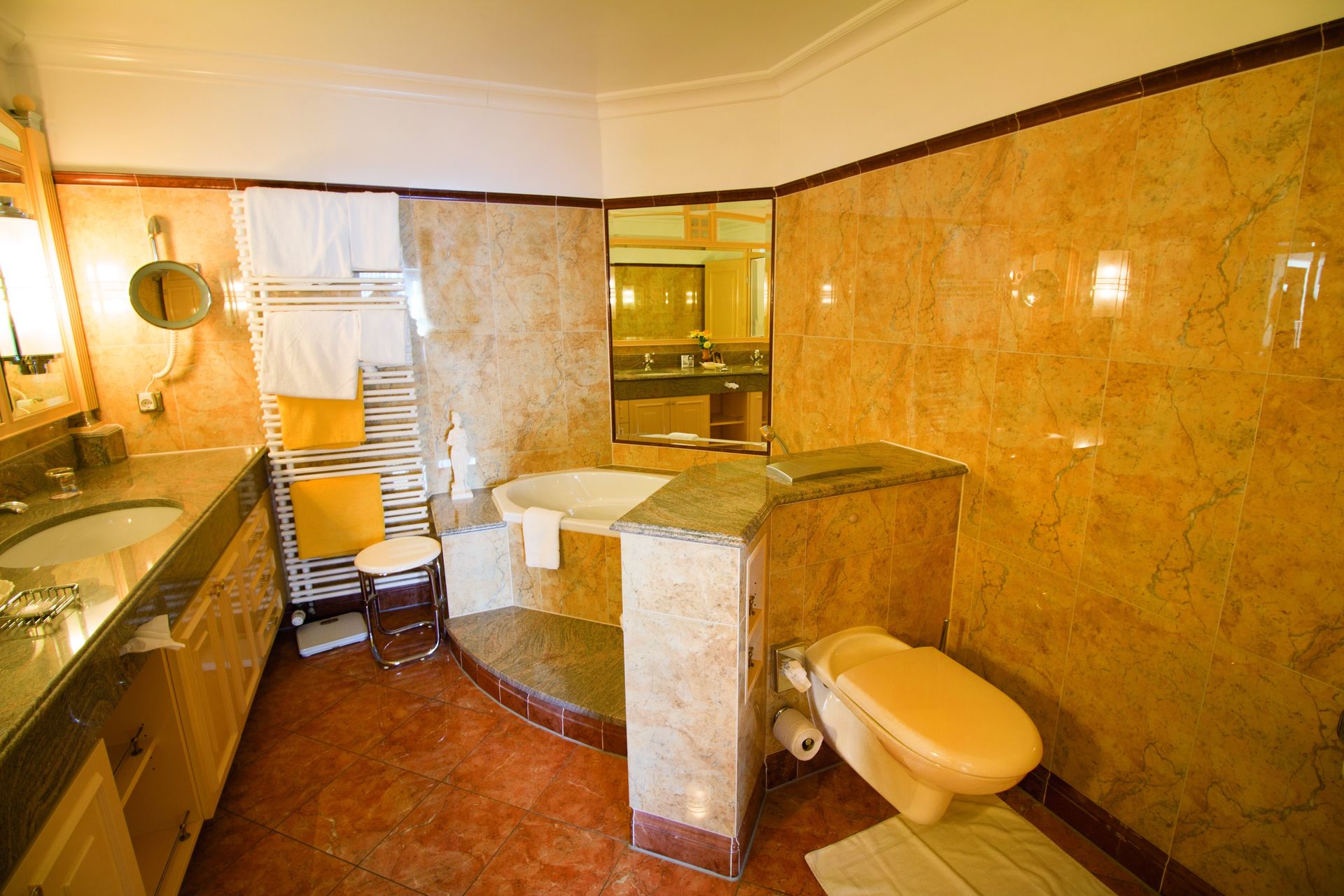A bathroom with a toilet , sink and bathtub