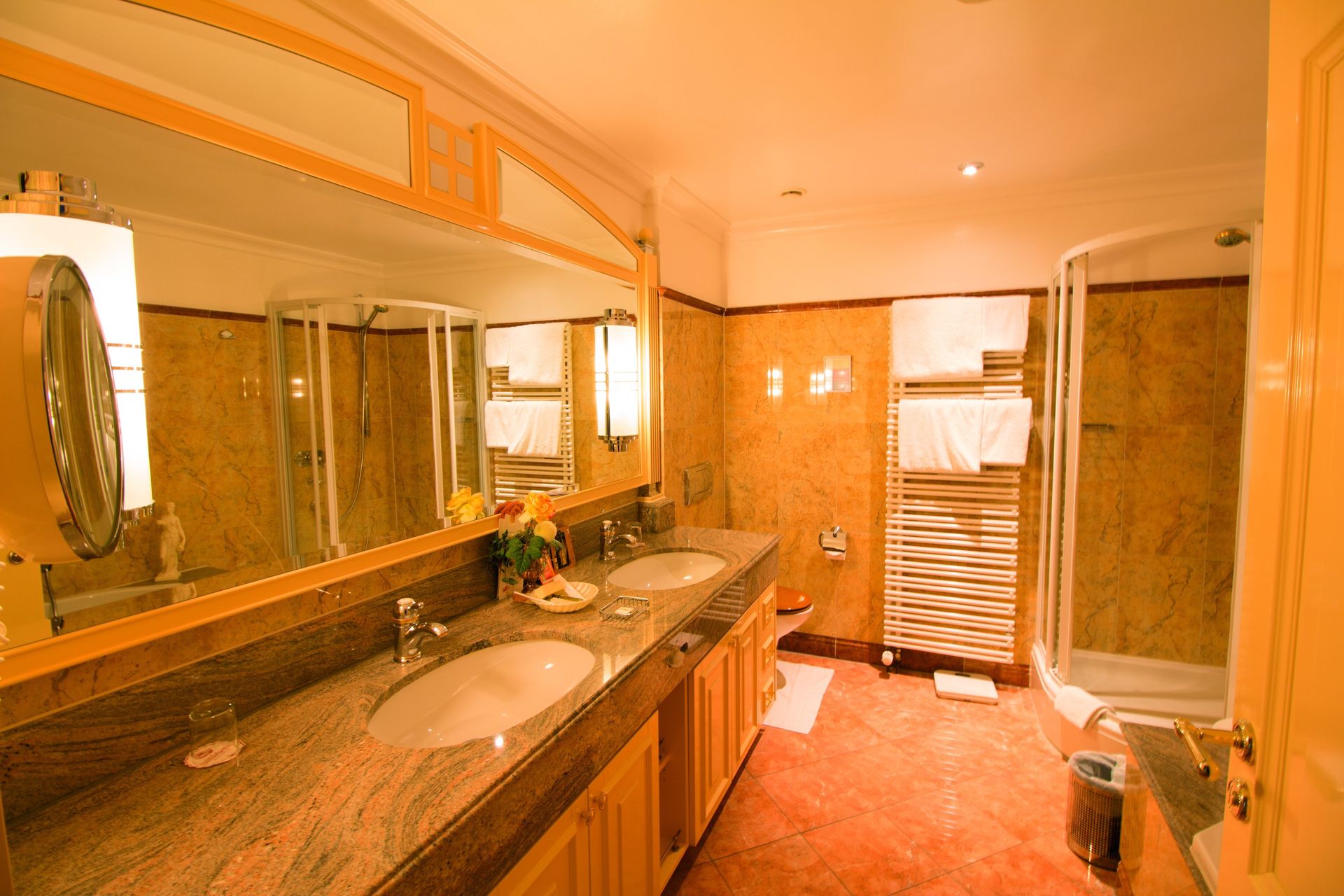 A bathroom with two sinks and a shower.