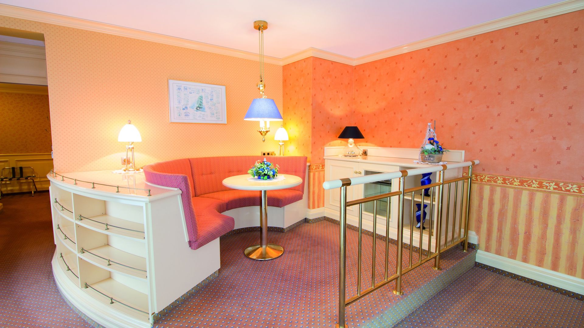 A room with a table and a couch in it.