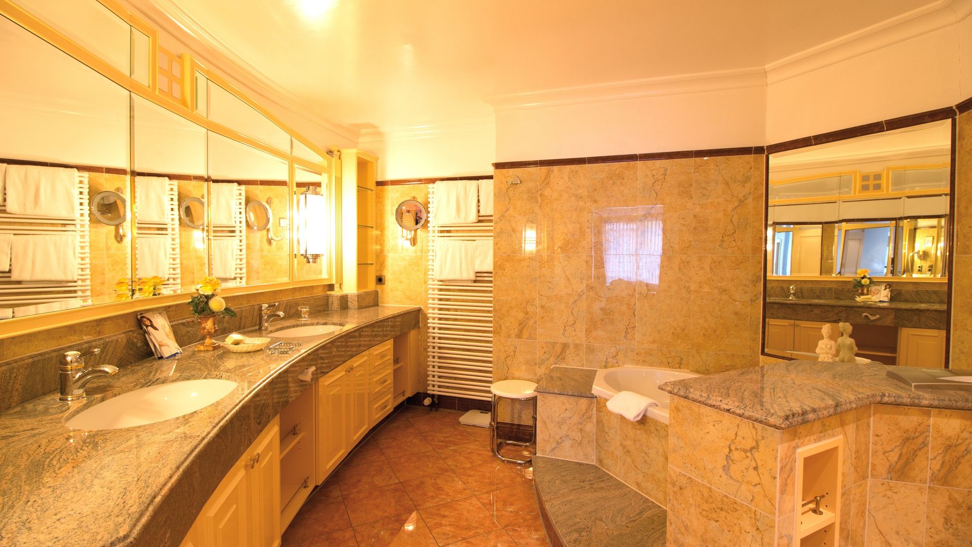 A bathroom with two sinks and a bathtub