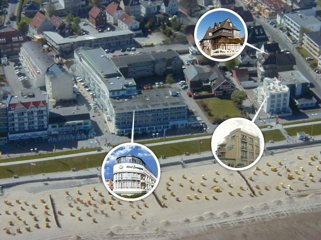 An aerial view of a city with buildings and a beach