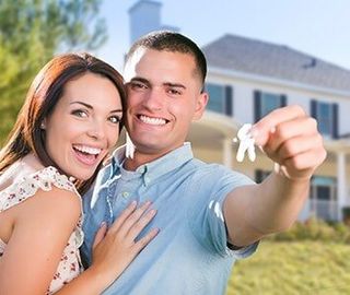 Homeowners Insurance Agency — Couple Holding a House Key in Burlington, NJ Homeowners Insurance Agency — Couple Holding a House Key in Burlington, NJ