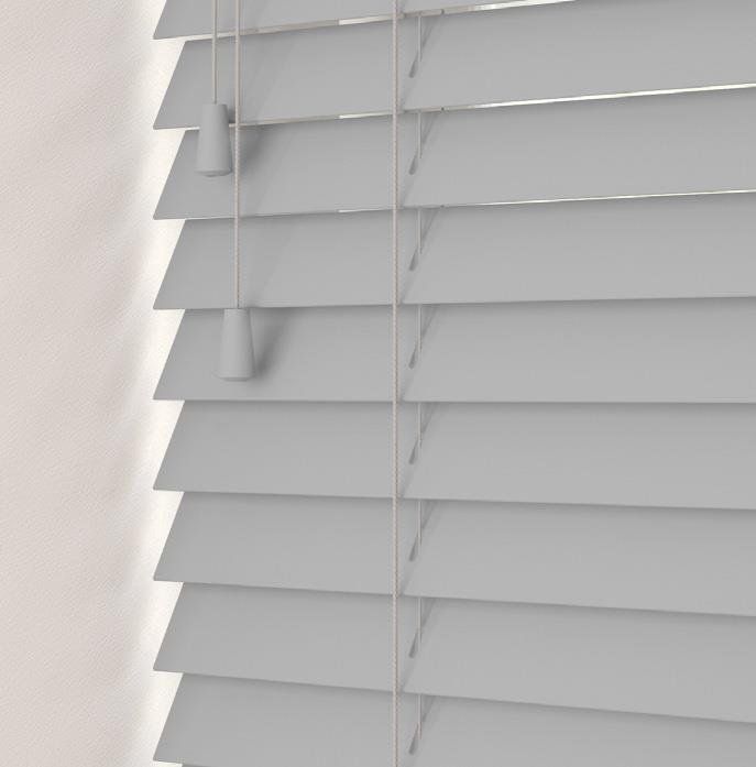 A close up of a grey wooden blind on a window.