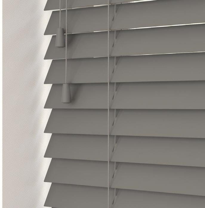 A close up of a gray blind on a window