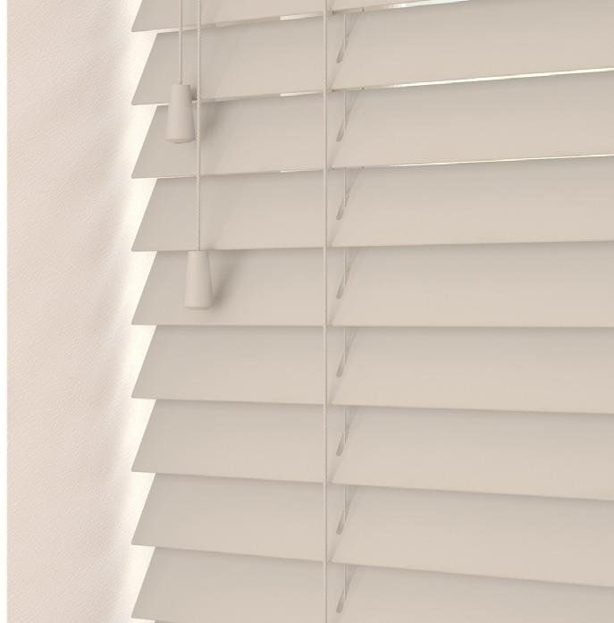 A close up of a white wooden blind on a window.