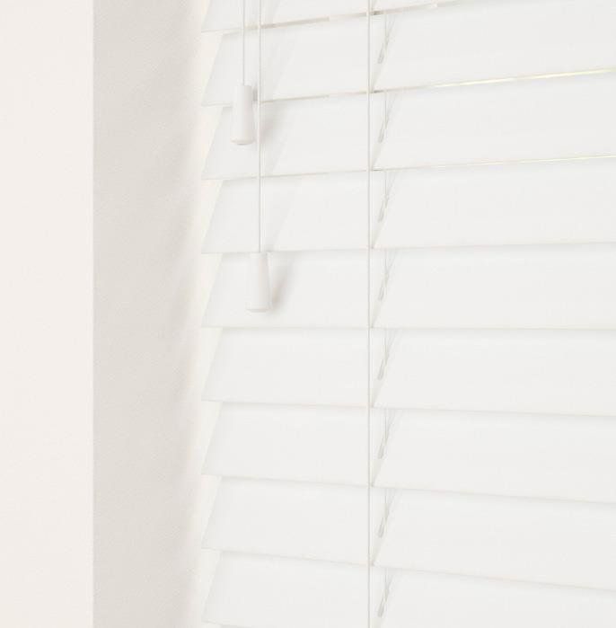 A close up of a white blind on a window.