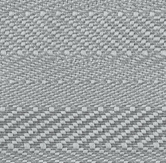 A close up of a gray fabric with a pattern on it.
