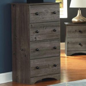A gray, wood-grain four-drawer chest stands next to a matching nightstand in a room with dark blue walls and hardwood floors.