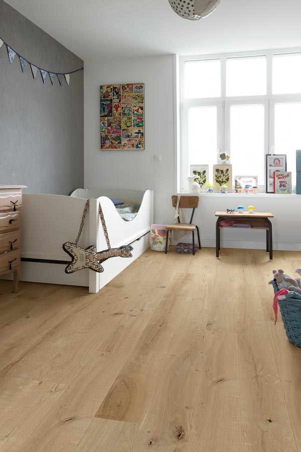 bedroom with light wood laminate flooring
