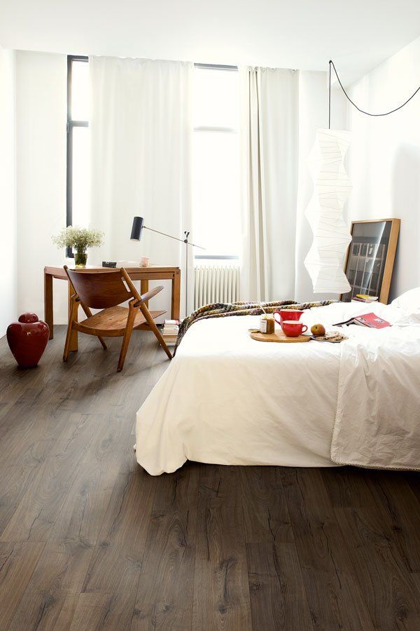 bedroom with dark laminate wood floors