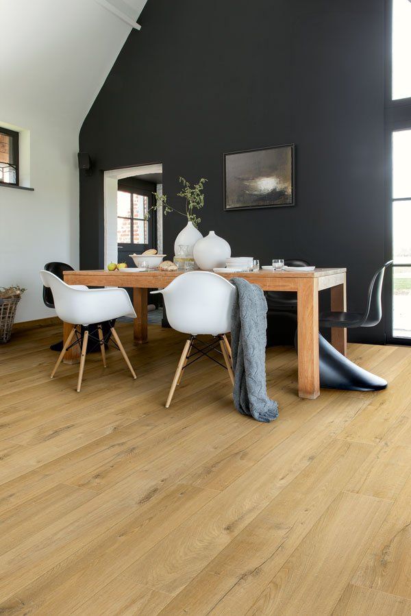 modern dining area with laminate wood floors