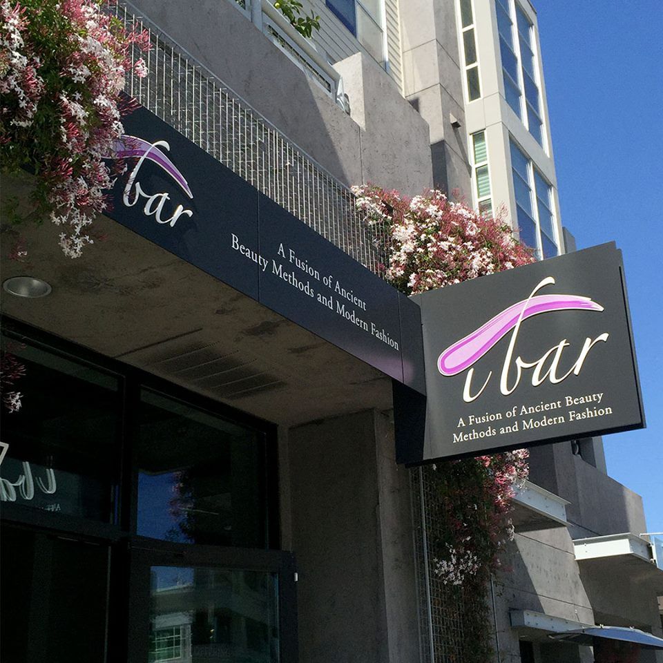 A building with a sign that says bar on it