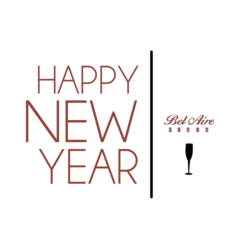 A sign that says happy new year with a champagne glass