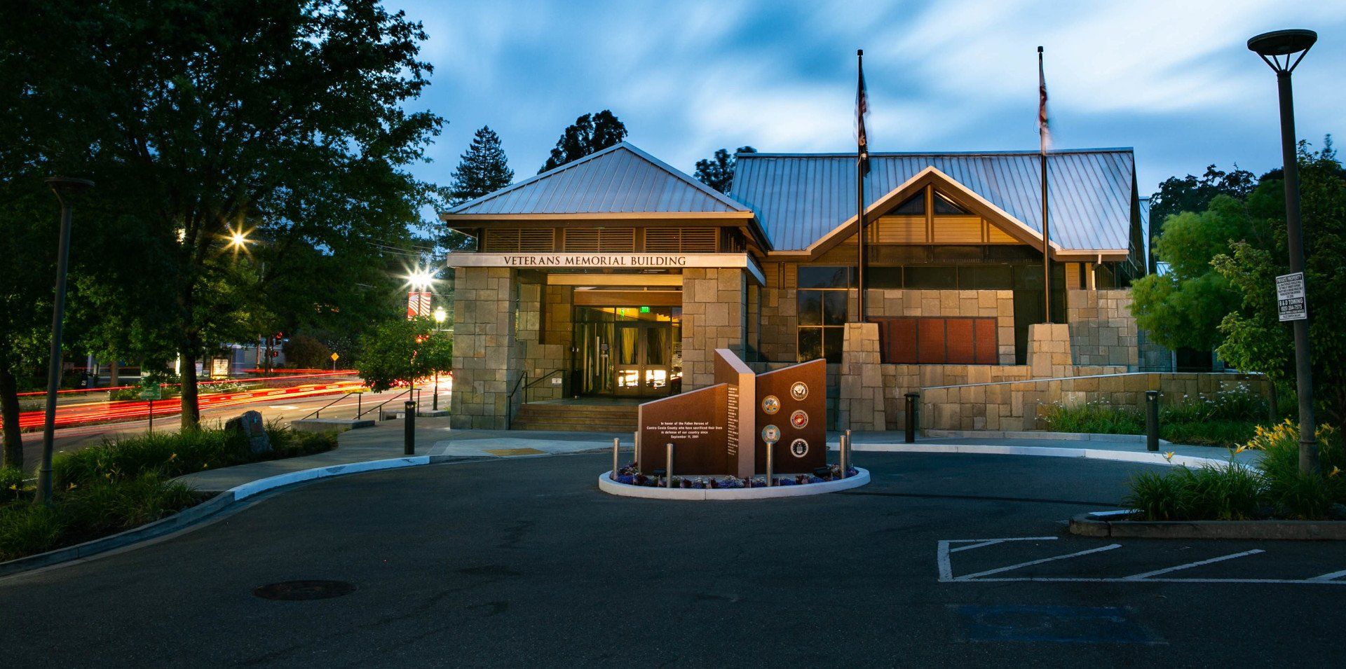 A large building with a parking lot in front of it