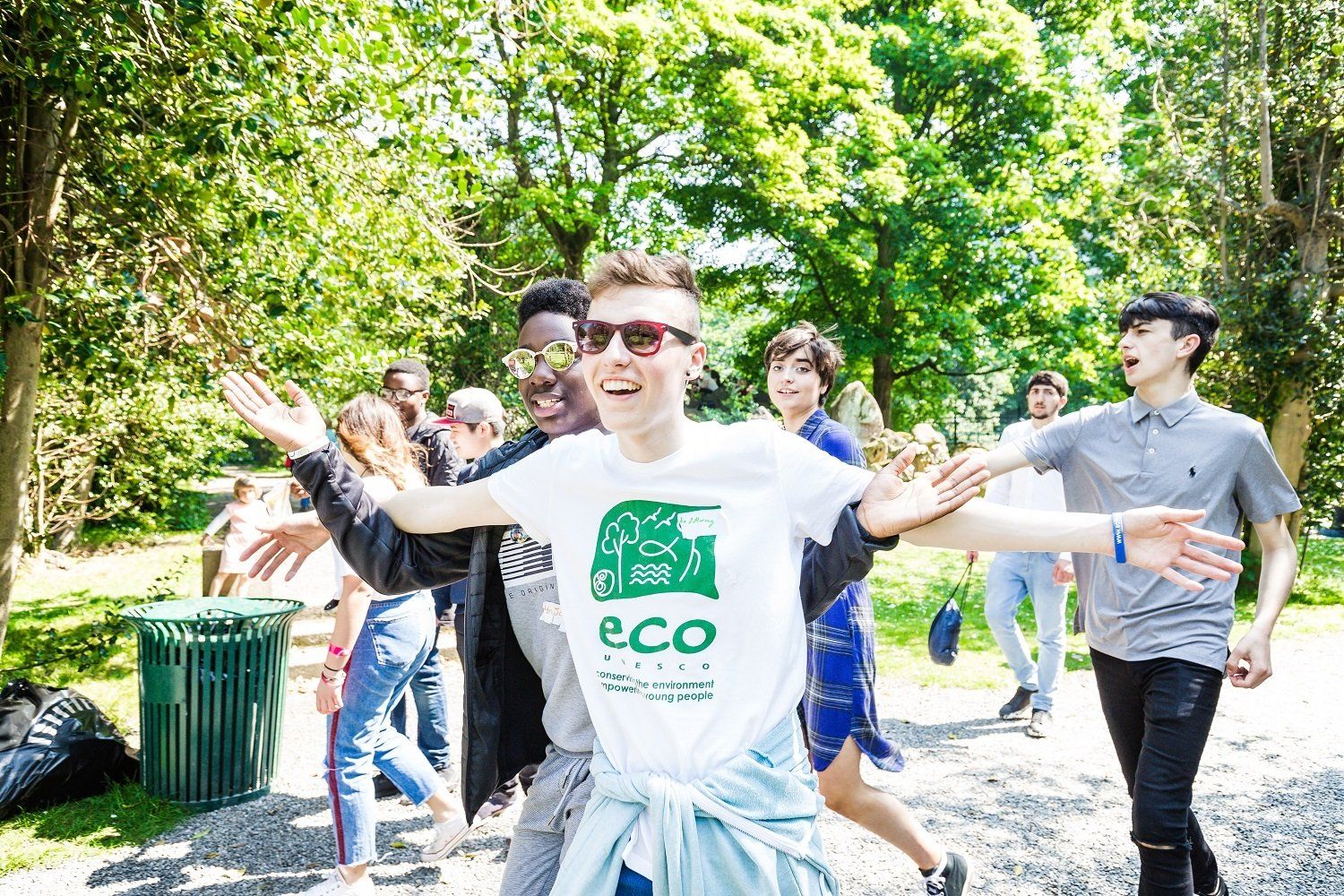 a man wearing a white shirt with the word eco on it
