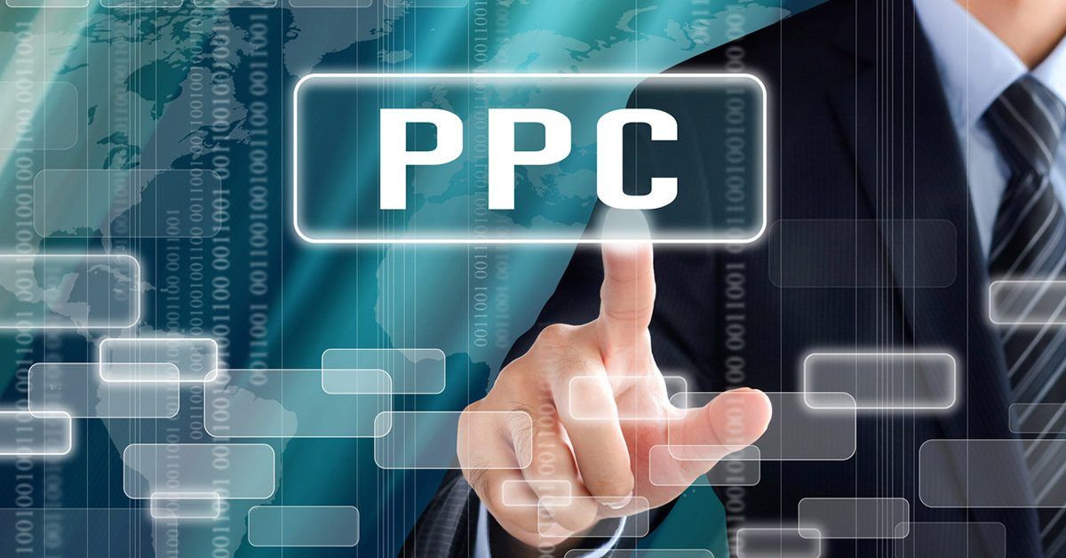 A person in a suit points at a digital