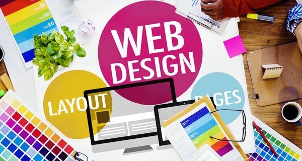 Web design concept: colorful layout with computer, color swatches, and design elements.