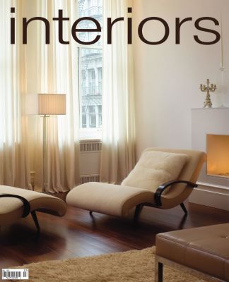 A magazine cover for interiors shows a living room with two chairs and a fireplace
