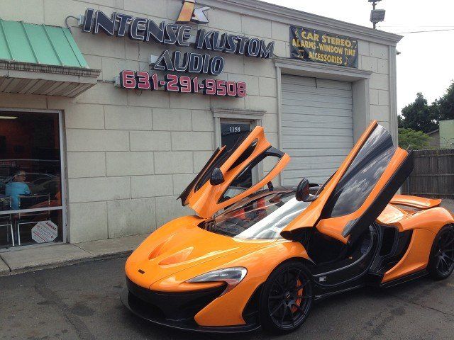 orange car with doors up