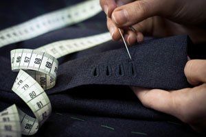 Man sewing with a needle