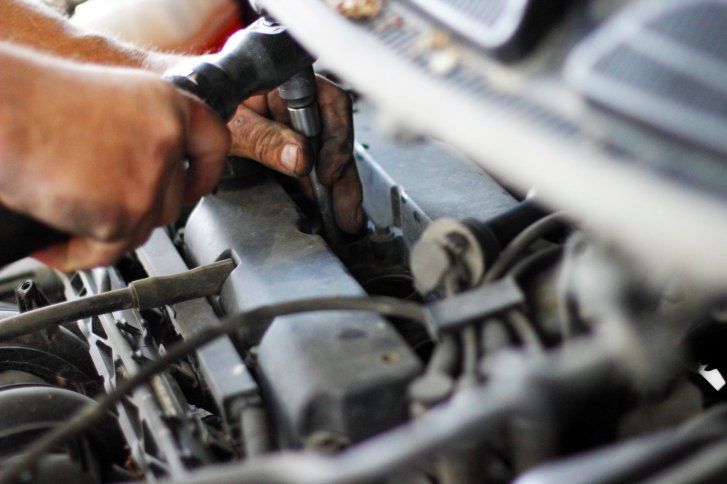 Hand of auto mechanic with a wrench - Towing Services and Auto Repair in Hinckley, MN Hand of auto mechanic with a wrench - Towing Services and Auto Repair in Hinckley, MN