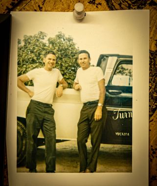 Dennis Turner with brother Darrrell Turner standing next to the Turner's Fine Carpets Truck in the 1960's